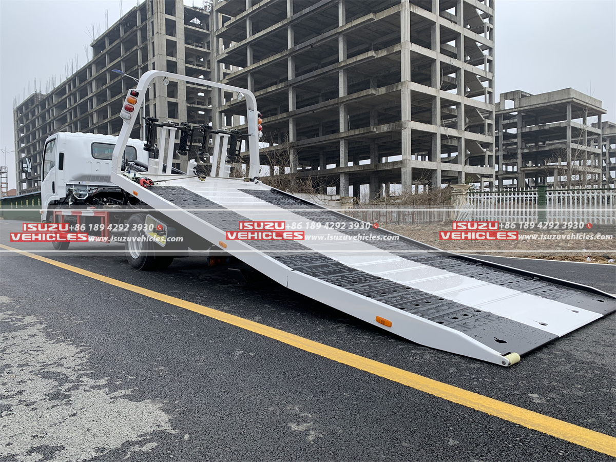 ISUZU 4 Ton Flatbed Rollback Tow Truck Side Working ISUZU 4 Ton Flatbed Rollback Tow Truck Side Working